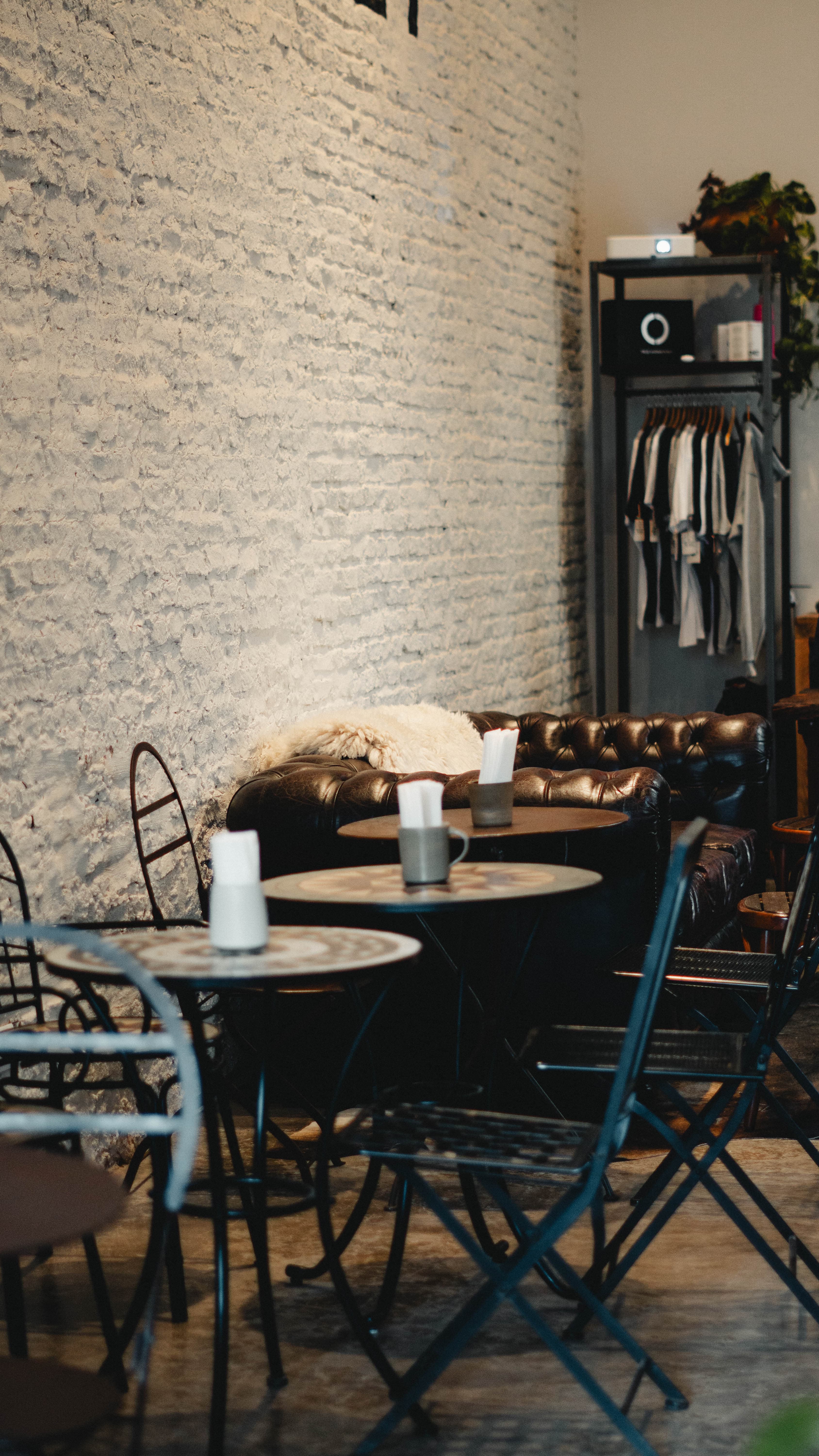 Café tables and the leather couch